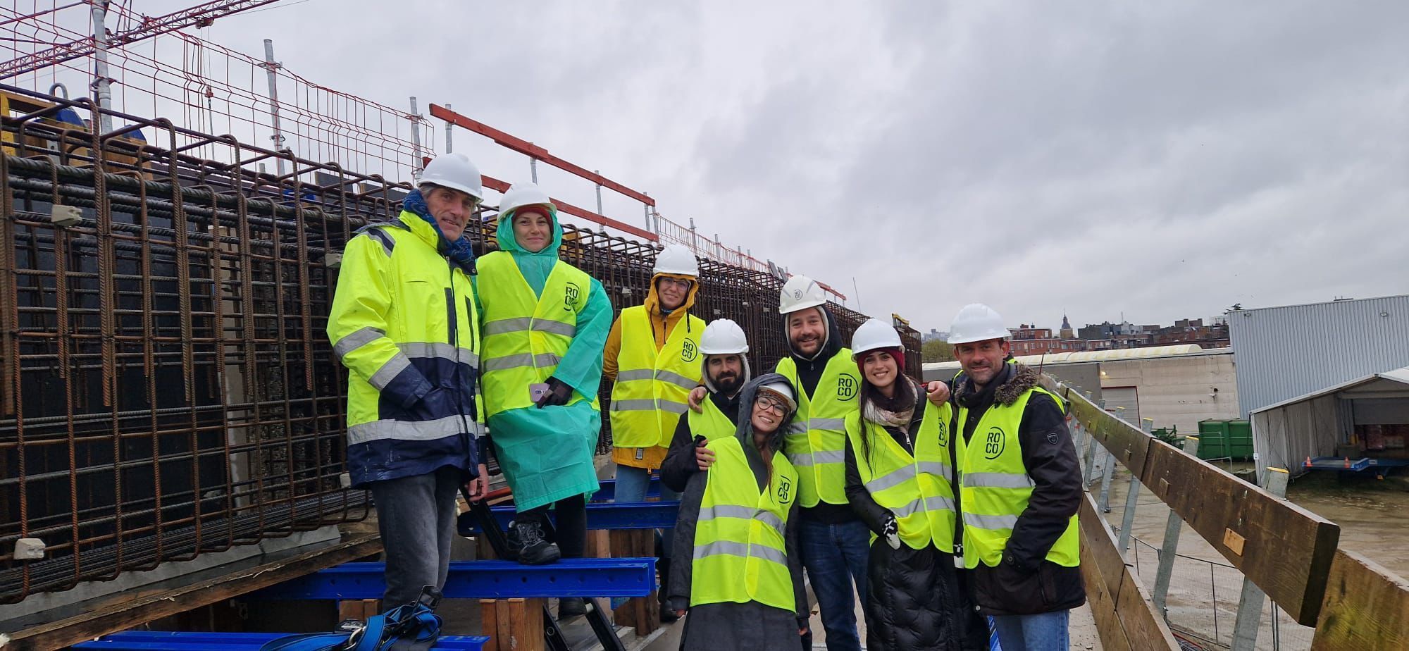 Construction workers collaborating on-site for rebar detailing and shop drawing execution